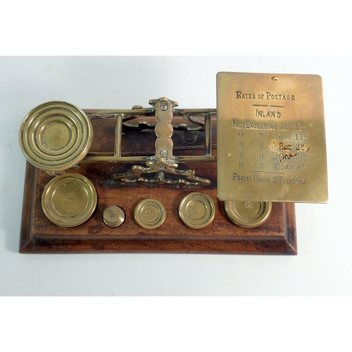 1084 - An antique  set of mahogany and brass postal scales, 20cm