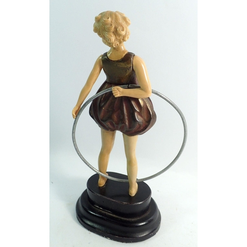 1085 - A 1920's reproduction figure in the style of Ferdinand Preiss of a girl with a hoop, 22cm tall