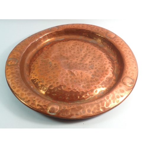 1090 - A set of three copper embossed circular dishes, largest 43cm