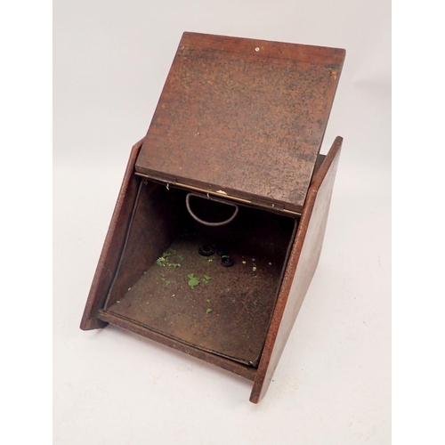 1094 - An Edwardian carved coal scuttle with brass handle