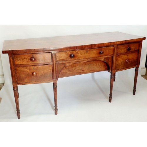 1103 - A George III large mahogany bow fronted sideboard with frieze drawer and curved apron drawer flanked... 