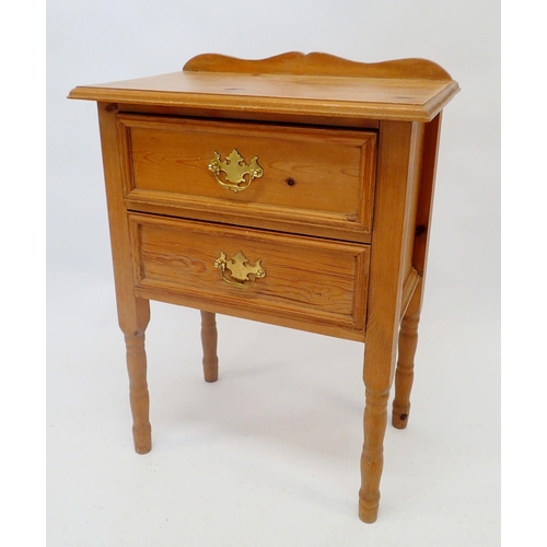 1139 - A pine two drawer bedside cabinet, 56cm wide