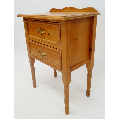 1139 - A pine two drawer bedside cabinet, 56cm wide