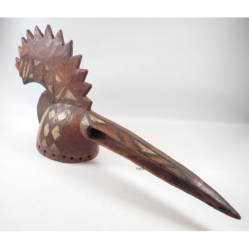 1153 - A carved Mossi bird mask from Burkino Faso with long beak and large crest, 70cm long