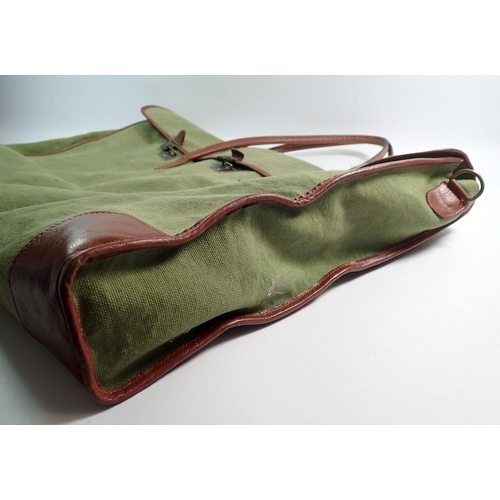 1156 - A Brady style green canvas and leather bag with shoulder strap, inside label 'Made in Florence for C... 