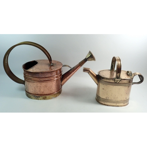 1157 - A Victorian copper and brass watering can, 29cm tall an a brass hot water can, 25cm tall