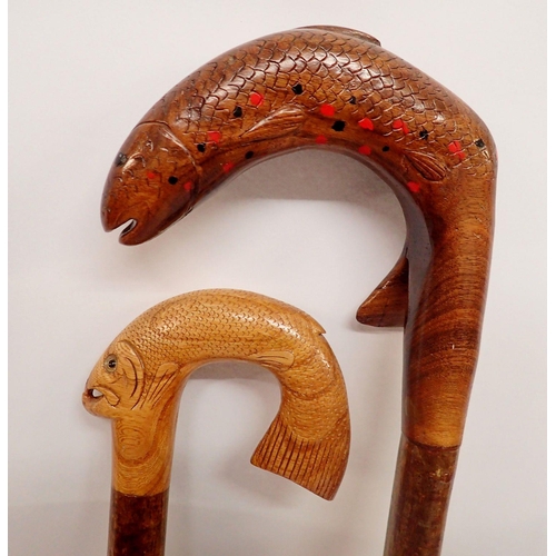 1158 - Two carved fish handle walking sticks