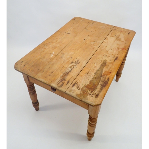 1170 - A Victorian pine farmhouse table with end drawer and turned supports, 104 L x 74 W x 73.5 H cm