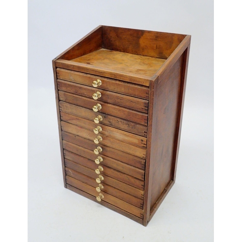 1186 - A collectors table top cabinet of twelve drawers, 59 x 36 x 27cm