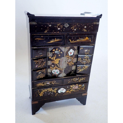 1188 - An early 20th century Japanese lacquer jewellery table top cabinet with painted decoration and inlai... 