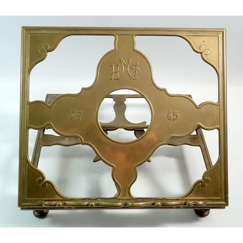 1189 - An antique brass Gothic book rest initialled HMF and with inscription dated 1765, 29.5 x 25.5cm