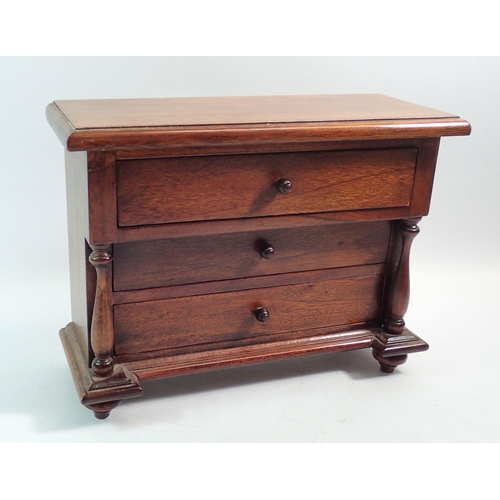 1196 - A 20th century mahogany apprentice piece miniature chest of three drawers, 22 x 28cm