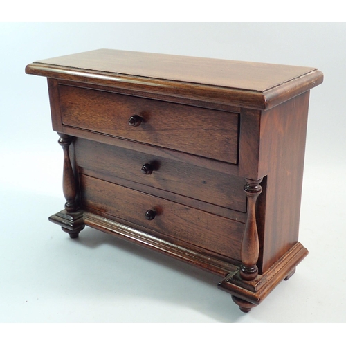 1196 - A 20th century mahogany apprentice piece miniature chest of three drawers, 22 x 28cm