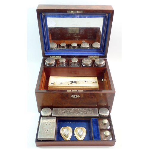 1201 - A Victorian walnut cased toiletry and work box with fitted interior and contents of glass and silver... 