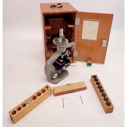 1208 - An Olympus Tokyo high powered microscope with lenses, certificate and light - boxed, 49 x 27 x 30cm