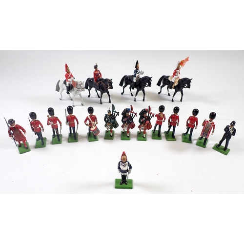 1219 - A group of 18 Britains lead painted figures including Elizabeth II riding side saddle, soldiers, pol... 