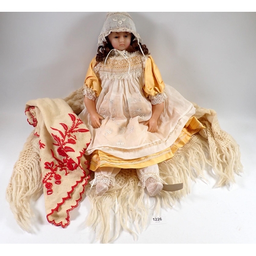 1226 - A Victorian wax doll with glass eyes, wax arms and dressed in clothing by Fashion designer Michael S... 