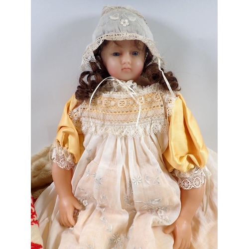 1226 - A Victorian wax doll with glass eyes, wax arms and dressed in clothing by Fashion designer Michael S... 