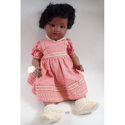 1227 - An Armand Marseille black character doll, glass sleeping eyes, numbered 99012, 60cm