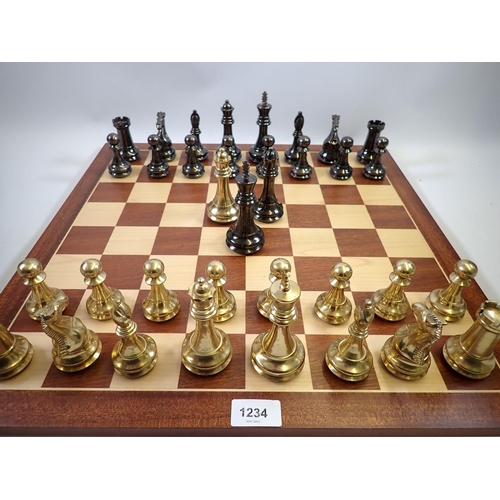 1234 - A Spanish turned brass and bronze finish chess set and marquetry chess board, 50 x 50cm