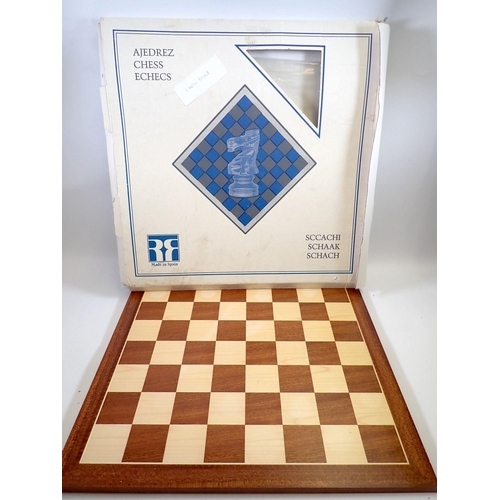 1234 - A Spanish turned brass and bronze finish chess set and marquetry chess board, 50 x 50cm