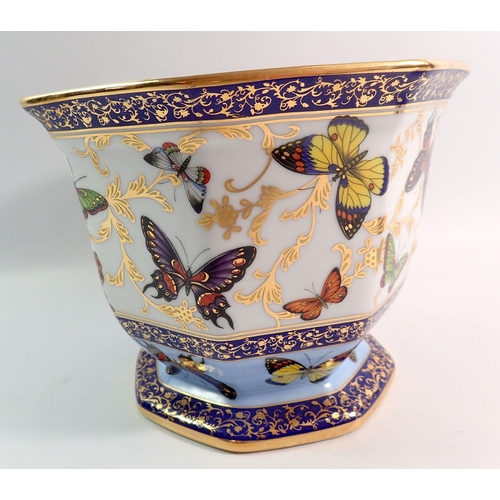 126 - A Past Times jardiniere printed butterflies and a floral painted pierced basket