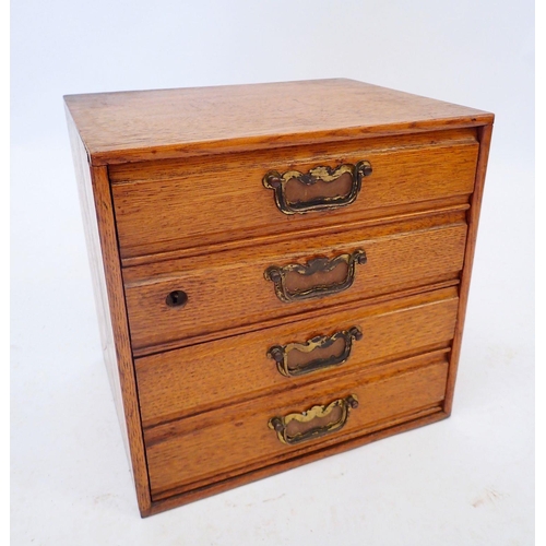 1313 - A vintage oak table top set of four filing drawers, 26 x 31 x 32cm wide