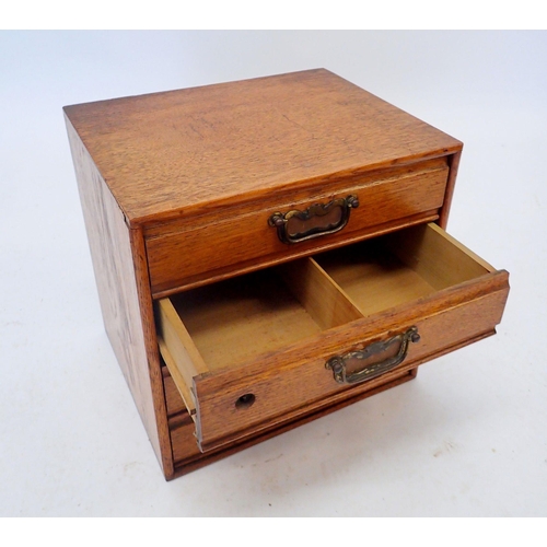 1313 - A vintage oak table top set of four filing drawers, 26 x 31 x 32cm wide