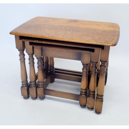 1316 - A nest of oak occasional tables on turned supports, largest 59 x 37cm