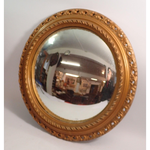 1317 - A circular convex mirror with pierced gilt surround, 47cm