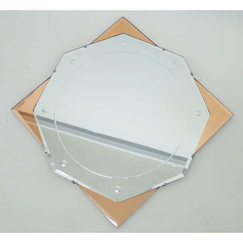 1318 - An Art Deco pink framed star form mirror, 70cm diameter