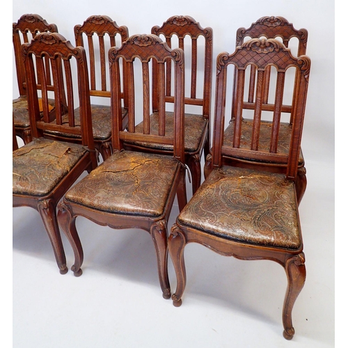 1322 - A set of eight French slat back dining chairs with trellis and scrollwork carved top rail