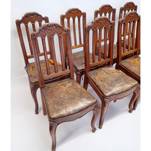 1322 - A set of eight French slat back dining chairs with trellis and scrollwork carved top rail