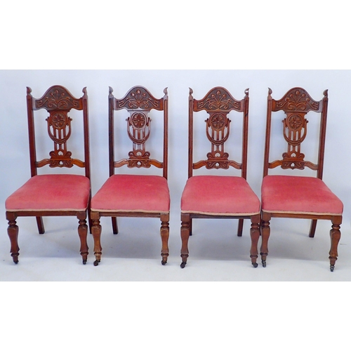 1327 - A set of four Edwardian dining chairs with Art Nouveau carved floral top rail