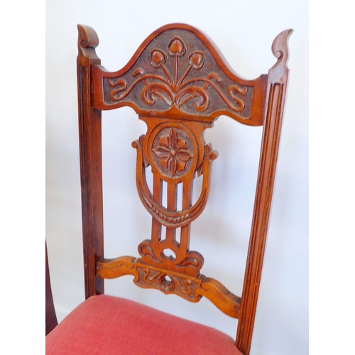 1327 - A set of four Edwardian dining chairs with Art Nouveau carved floral top rail