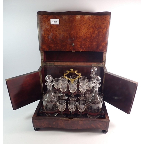 1334 - A 19th century French amboyna travelling decanter box with fitted interior including four cut glass ... 