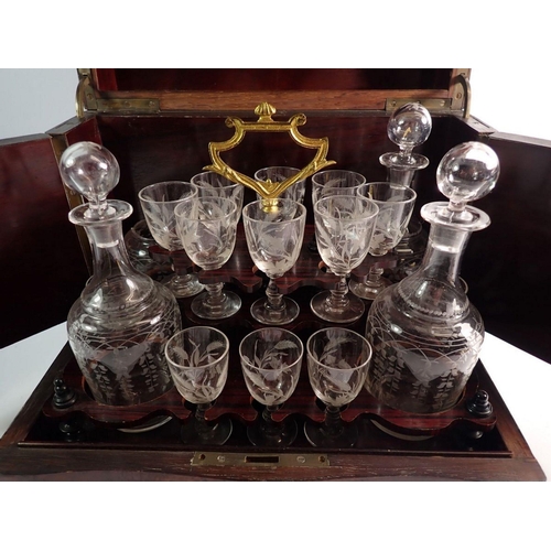 1334 - A 19th century French amboyna travelling decanter box with fitted interior including four cut glass ... 