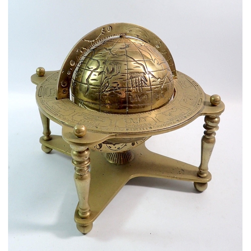 1355 - A brass table globe with zodiac signs, 25cm diameter