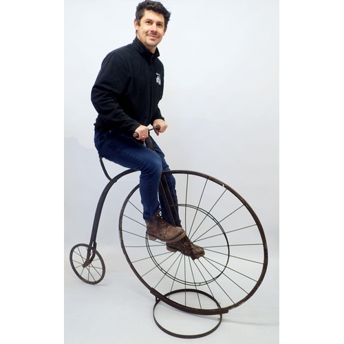 1357 - A reproduction iron Penny Farthing bicycle, stands 130cm tall