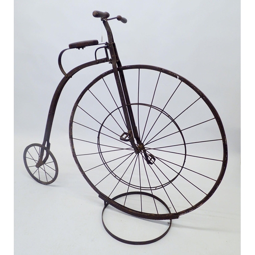 1357 - A reproduction iron Penny Farthing bicycle, stands 130cm tall