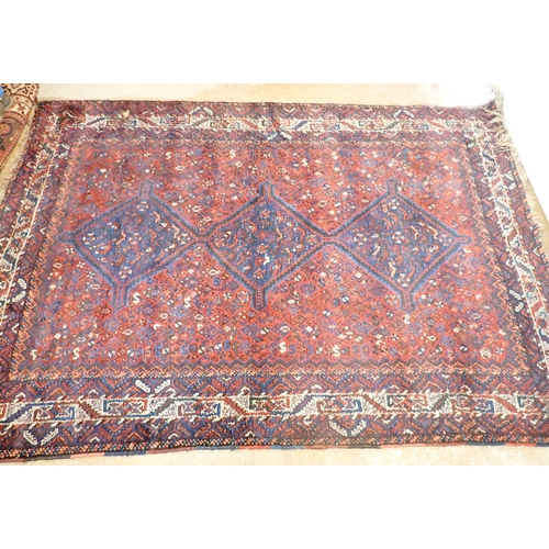 1361 - A Turkoman rug with triple lozenge design on a red ground 326 x 228cm