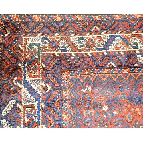 1361 - A Turkoman rug with triple lozenge design on a red ground 326 x 228cm