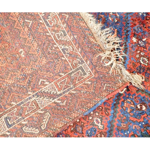 1361 - A Turkoman rug with triple lozenge design on a red ground 326 x 228cm