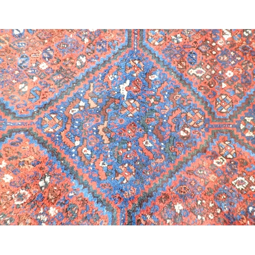 1361 - A Turkoman rug with triple lozenge design on a red ground 326 x 228cm