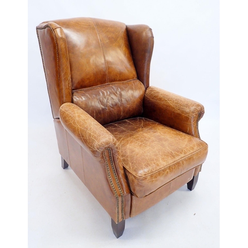 1368 - A leather finish recliner chair