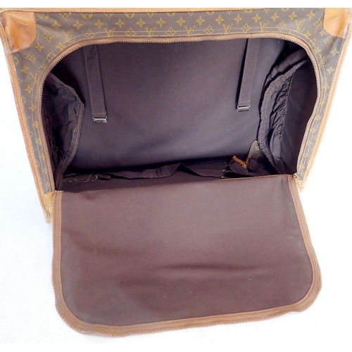 1369 - A Louis Vuitton early 20th century suitcase made in the USA, soft sides, label to interior - handle ... 