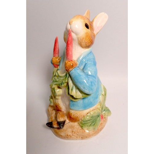 138 - A pair of Border Fine Arts Peter Rabbit bookends, a large china Peter Rabbit money box 16.5cm tall, ... 