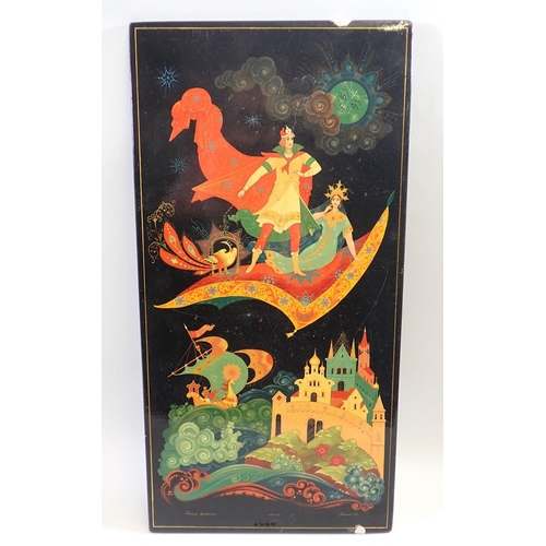 1380 - A Russian lacquer fairy tale picture with flying carpet, signed and titled - chipped, 42 x 21cm