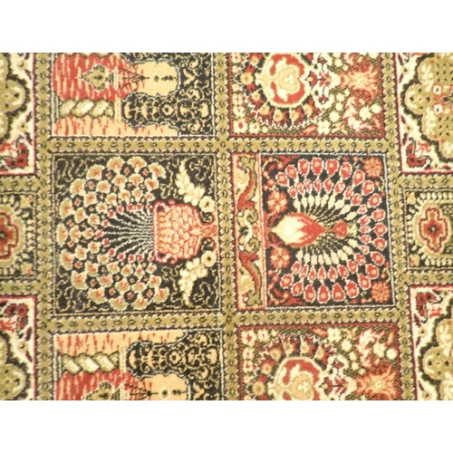 1382 - A green Persian style machine made rug  with peacock design 176 x 91cm