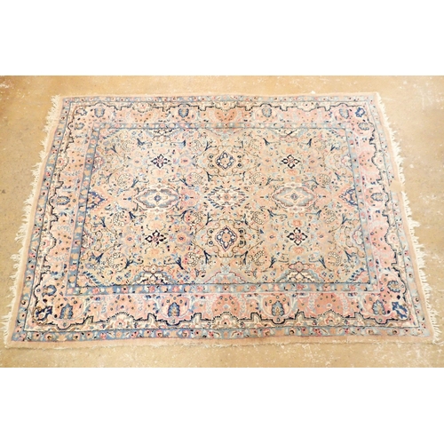 1384 - A Persian style rug with stylised floral design on a pale pink ground 201 x 148cm